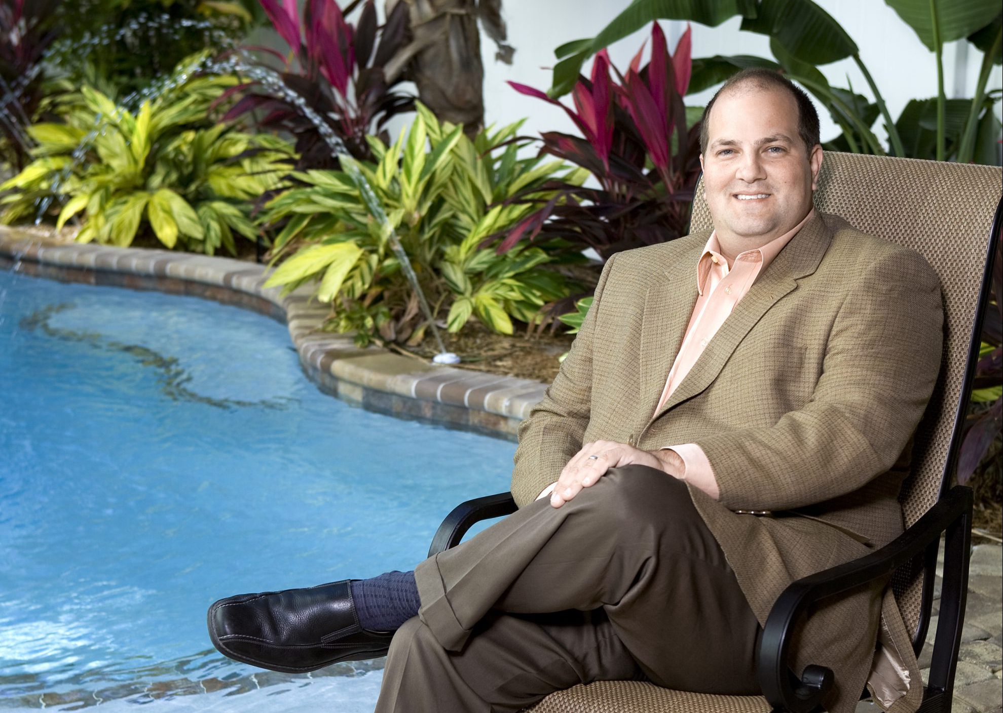 Larry Chatt sitting by the pool