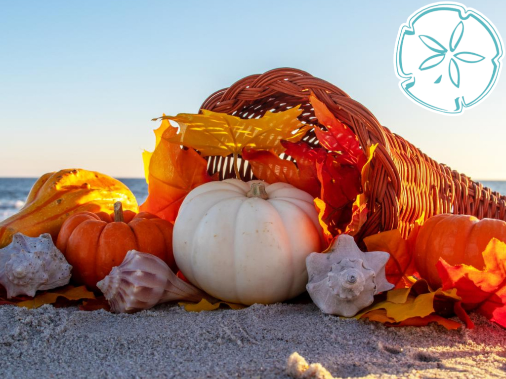 Pumpkins and cornucopia on the beach